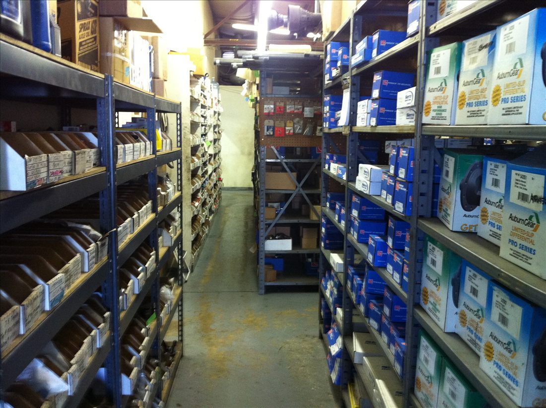 Aisle of stocked driveline parts at Driveline & Gear Service